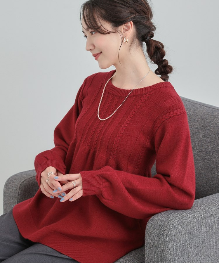 ケーブルペプラムニット