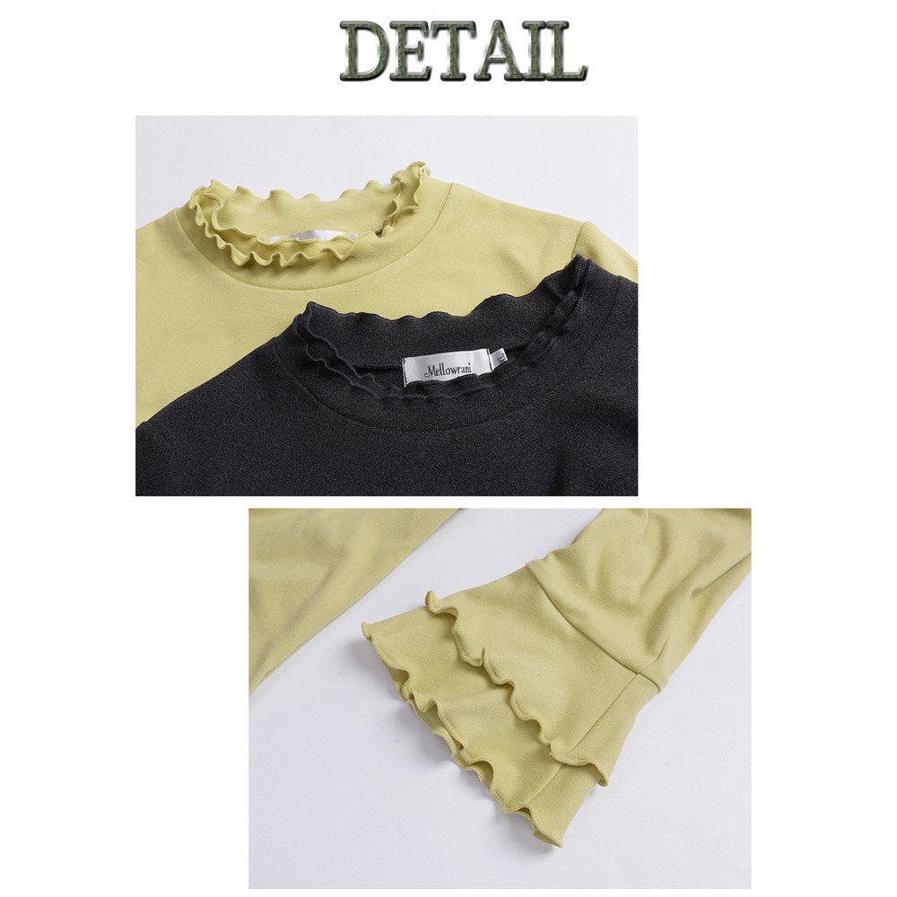 二重フリルのスタンドカラーとベルカフのフィット感のあるトップス18