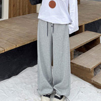 フラワーボタンがアクセント！暖かな裏起毛スウェットワイドパンツ